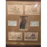 Framed WWI silk cards and a photo of the sender