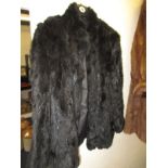 A waist length Natural Coney fur jacket