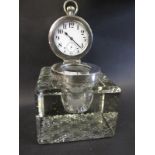 A large Edwardian sterling silver topped ink bottle having a watch mounted inside the lid