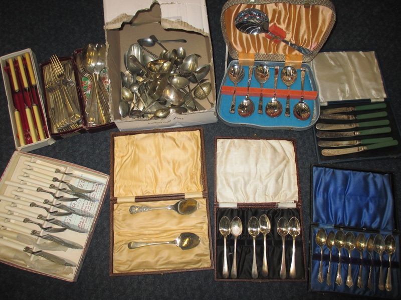 A large quantity of boxed and un-boxed table cutlery