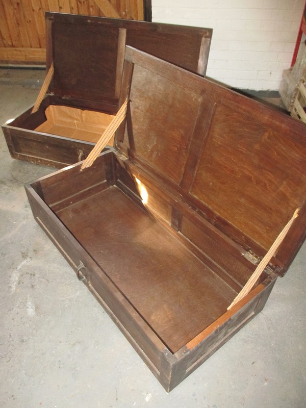 Two early 20th century stained pine clothes trunks