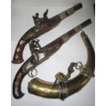 Two decorative, bone and silver inlaid, flintlock pistols and a brass horn