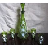 A green glass decanter and 4 glasses enamelled with stylised flowers