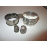 Two silver napkin rings 2 thimbles and a coin