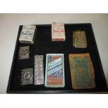 A quantity of collectable items to include playing cards and photo commemoratives