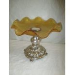 An Italian silver comport with amber glass top