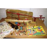 A quantity of vintage toys and games to include tinplate, board games and electrotor-powered