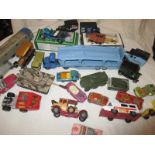 An assortment of play worn die-cast vehicles