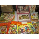 A quantity of vintage wood jigsaw puzzles and some ladybird books