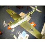 A 60 inch wing span model plane with numerous accessories and extra engines