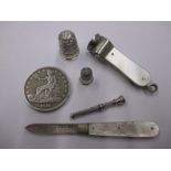 A quantity of collectable items to include a silver thimble and pen knife