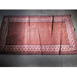 A vintage Persian hand woven wool rug