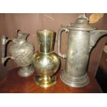 A pewter coffee pot by Arnold & Lewis, a brass alter vase and another pewter ewer