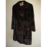 A 1970's Canadian squirrel fur coat with original invoice