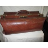 An early 20th century leather Gladstone bag