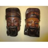 Two Chinese carved wood wall masks