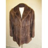 A Musquash fur coat by Falkners