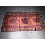 A vintage Persian hand woven wool rug