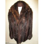 A half length Musquash fur coat