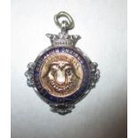 A sterling silver Buffalo medallion with gold centre