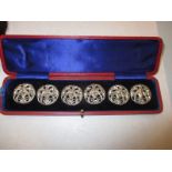 A boxed set of silver art nouveau buttons