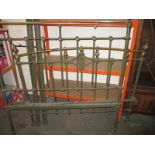 A brass and painted iron double bed