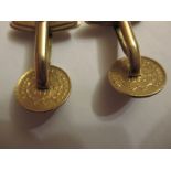 A pair of gold cufflinks made from 1853 American coins