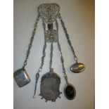 A plated Chatelaine with 5 silver accoutrement’s one a rare looking glass