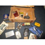 A box of interesting collectables to include WWII medals and motoring items