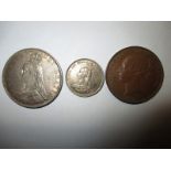 An 1887 silver crown and a shilling and an 1841 copper penny