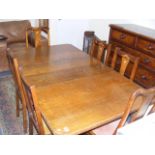 An Antique Oak Dining Table With Six Chairs