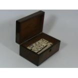 A Dominoes Set In Walnut Veneer Box