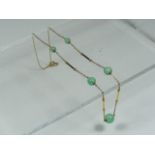 A Ladies 9ct Gold Necklace With Jade Beads