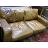 A Large Brown Leather Sofa