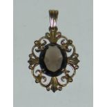 A 9ct Gold Pendant With Smoky Quartz Stone