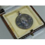 A Silver Commemorative Coin Pendant In Box