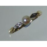 A Ladies Diamond & Pearl Ring