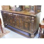 An Antique Gothic Style Oak Sideboard With Inlaid Bogwood Style Doors