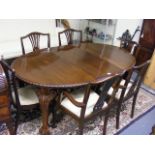 An Antique Mahogany Dining Table With Six Chairs
