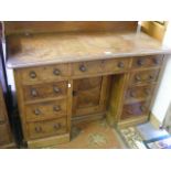 An Antique Knee Hole Desk With Nine Drawers