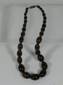 A Set Of Vintage Polished Wood Beads