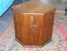 A Small Oak Corner Wall Cabinet