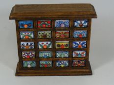 A Decorative Wooden Spice Rack With Ceramic Drawer