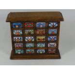 A Decorative Wooden Spice Rack With Ceramic Drawer