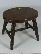 An Antique Elm Milking Stool