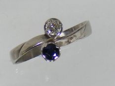 An 18ct white gold diamond and sapphire cross over