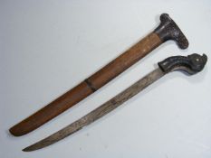 A Javanese Long Knife With Sheaf, Carving To Handl