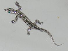 Silver brooch as lizard with marcasite and emerald