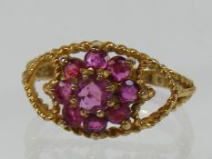 A Ladies Gold Ring With Pink Stones