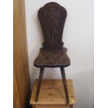 An Ethnic Styled Oak Hall Chair